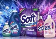 Assorted Soft laundry detergents and fabric softener bottles in blue, pink, and purple with lavender-themed packaging against a colorful splash background.