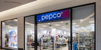 Pepco storefront with glass doors and a blue sign; clothing and home goods visible inside the store.