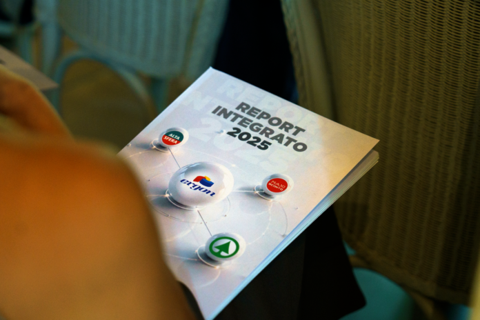 5 Cover page of a report titled 'Report Integrato 2025' with circular logo badges connected by lines.