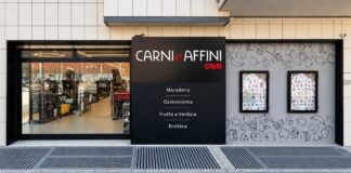Supercentro e Carni e Affini consolidano la partnership sotto insegna CRAI Storefront of Carni e Affini butcher and deli with a black sign listing Macelleria, Gastronomia, Frutta e Verdura, Enoteca.