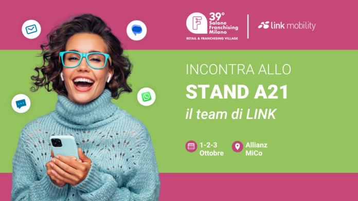 Copertina comunicato Promotional banner showing a smiling woman with teal glasses and sweater, inviting visitors to Stand A21 by LINK at Salone Franchising Milano.