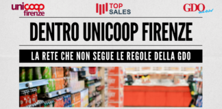 Banner announcing Unicoop Firenze with bold headline and subheading about not following GDO rules; shows a blurred supermarket aisle photo and logos top left/right and center-left.